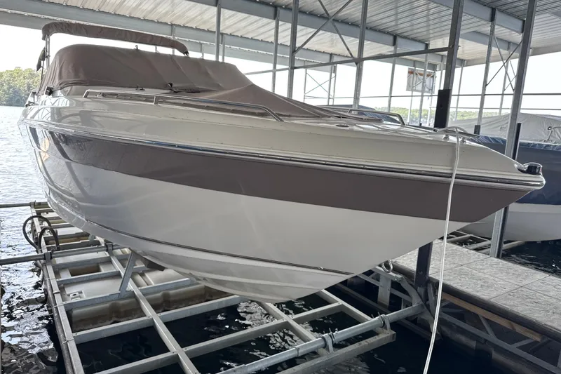 Slide: The Image of 2002 Regal 2900 LSR boat docked in a covered marina. - 1