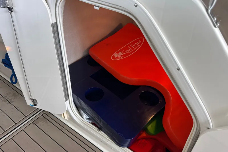 Slide: The Image of Storage compartment of a 2002 Regal 2900 LSR boat with colorful float mats. - 39