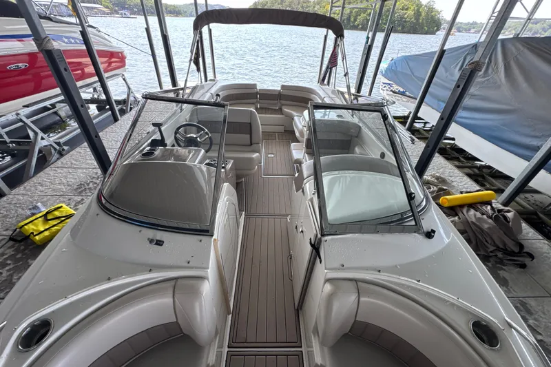 Slide: The Image of 2002 Regal 2900 LSR boat docked, featuring spacious seating and sleek design. - 34