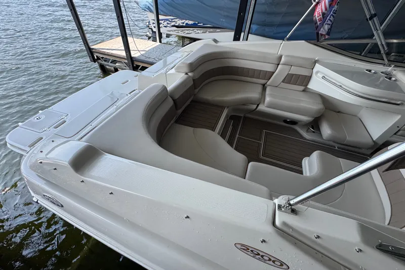 Slide: The Image of 2002 Regal 2900 LSR boat interior with spacious seating, docked by the water. - 37