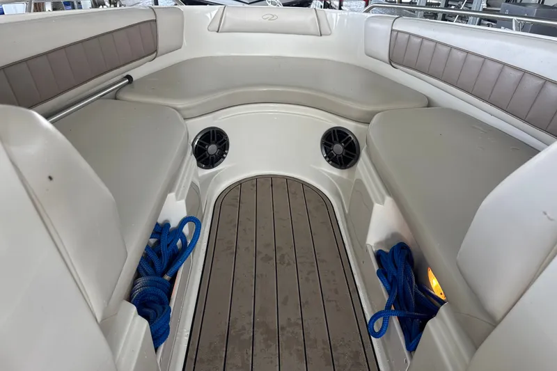 Slide: The Image of Interior of a 2002 Regal 2900 LSR boat with seating and storage compartments. - 27