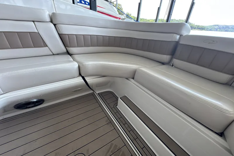 Slide: The Image of Luxurious seating on a 2002 Regal 2900 LSR boat with elegant upholstery. - 16