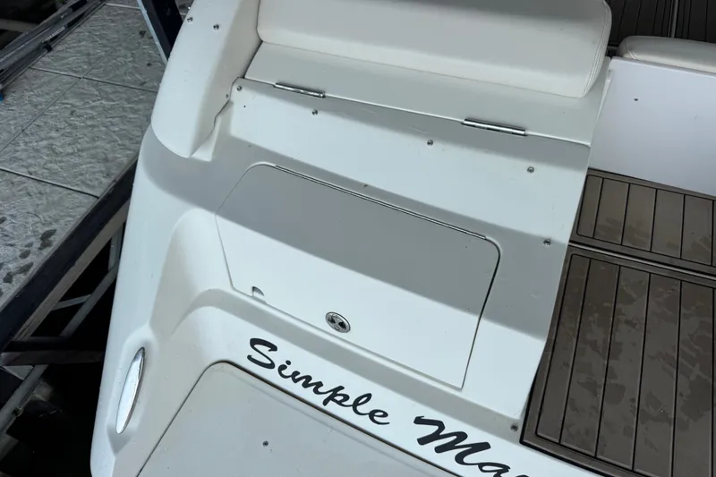 Slide: The Image of 2002 Regal 2900 LSR boat deck with "Simple Magic" text. - 42