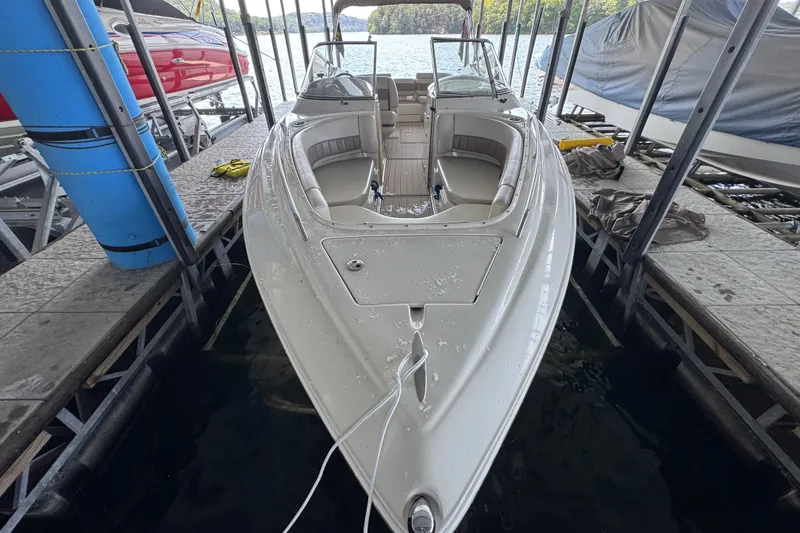 Slide: The Image of 2002 Regal 2900 LSR boat docked, featuring spacious seating and sleek design. - 6