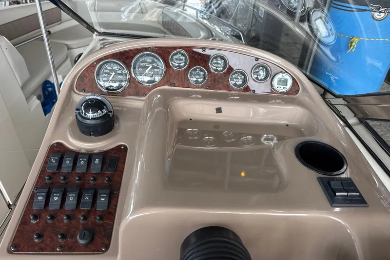 Slide: The Image of Dashboard of a 2002 Regal 2900 LSR boat with gauges and controls. - 12