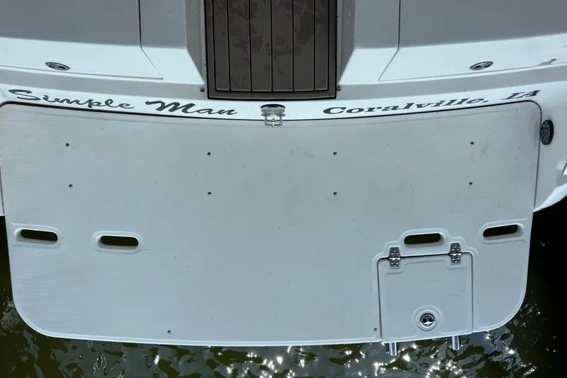 Slide: The Image of 2002 Regal 2900 LSR boat stern with "Simple Man" and "Coralville, LA" text. - 31