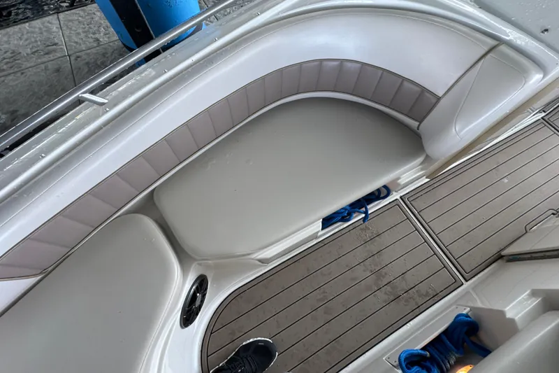 Slide: The Image of 2002 Regal 2900 LSR boat interior with cushioned seating and teak flooring. - 29