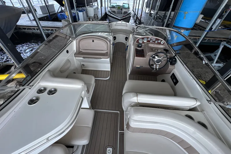 Slide: The Image of Interior view of a 2002 Regal 2900 LSR boat with seating and steering console. - 7