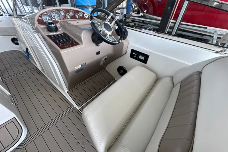 Slide: The Image of 2002 Regal 2900 LSR boat interior with steering wheel and dashboard controls. - 9