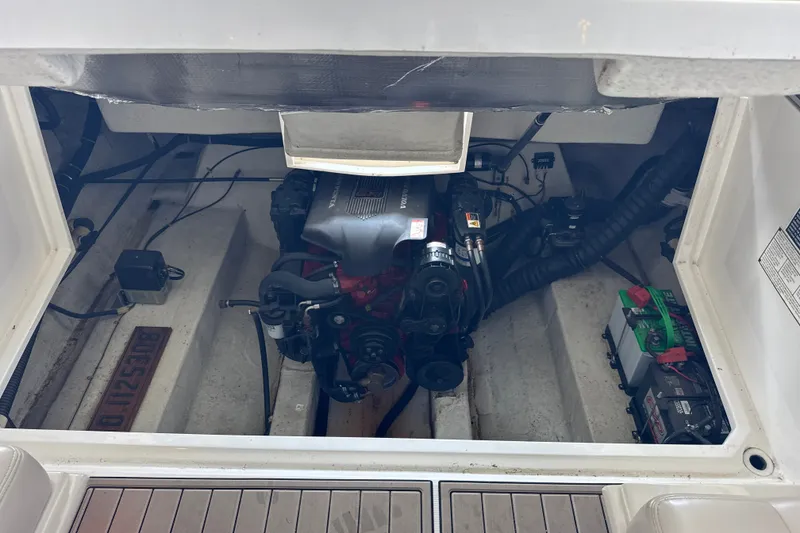 Slide: The Image of Engine compartment of a 2002 Regal 2900 LSR boat, showcasing engine and battery setup. - 40