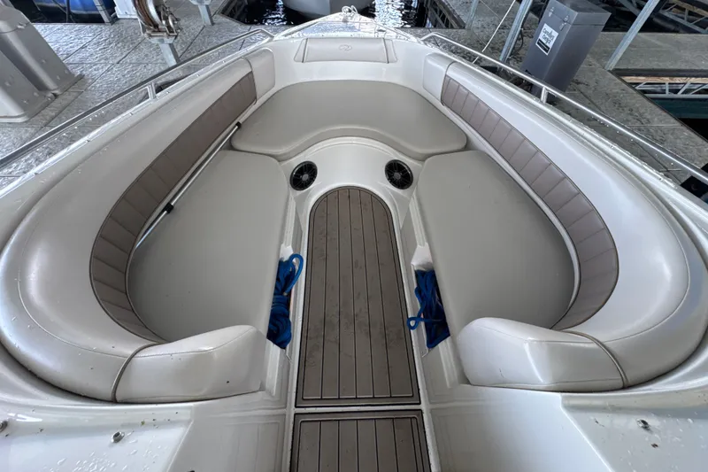 Slide: The Image of 2002 Regal 2900 LSR boat interior with cushioned seating and wooden flooring. - 25