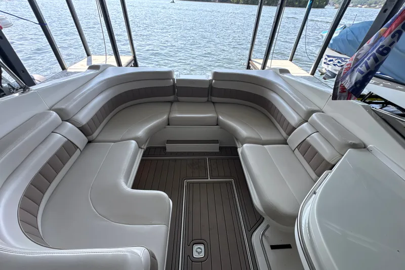 Slide: The Image of Spacious seating area on a 2002 Regal 2900 LSR boat, docked by the water. - 20