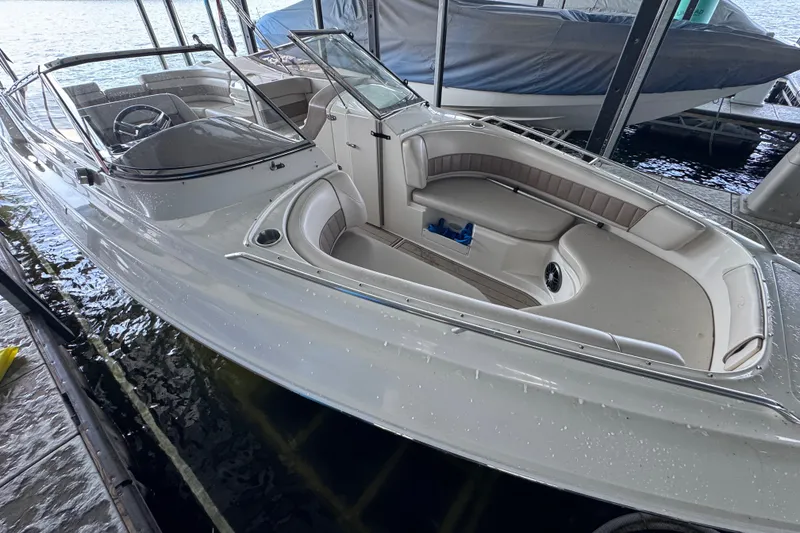 Slide: The Image of 2002 Regal 2900 LSR boat docked, featuring spacious seating and sleek design. - 36