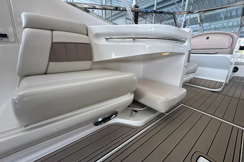 Slide: The Image of Interior seating of 2002 Regal 2900 LSR boat with cushioned seats and sleek design. - 23