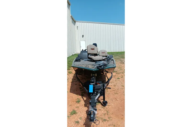 Slide: The Image of 2026 Tracker Bass Tracker Classic Limited boat on trailer, parked outdoors. - 14