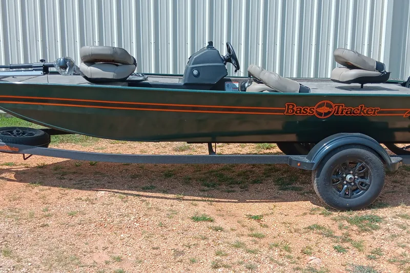The Image of 2026 Tracker Bass Tracker Classic Limited boat on trailer, parked outdoors. - 0