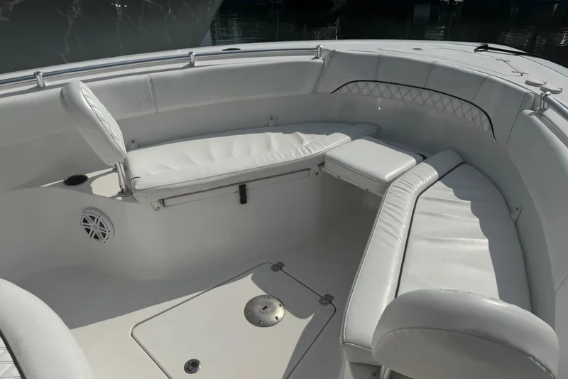 Slide: The Image of 2021 Sportsman Heritage 251 Center Console boat with white cushioned seating. - 19