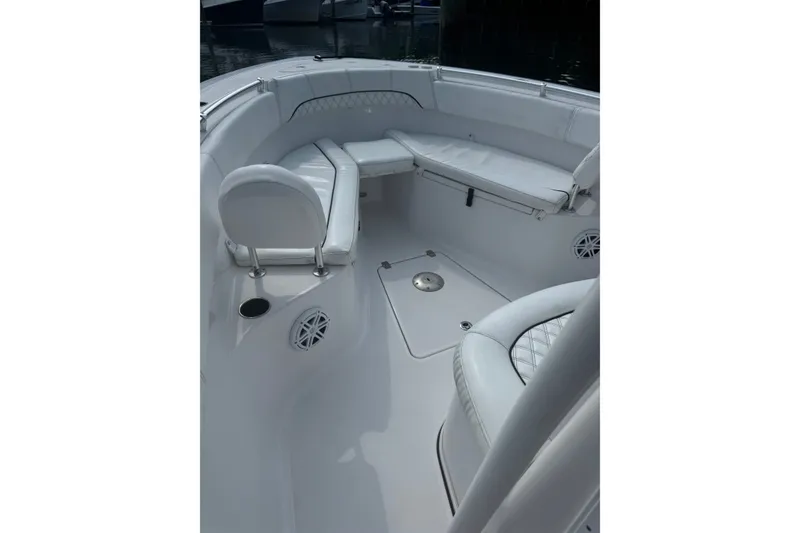 Slide: The Image of 2021 Sportsman Heritage 251 Center Console boat interior with cushioned seating. - 20