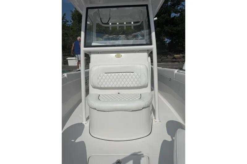 Slide: The Image of 2021 Sportsman Heritage 251 Center Console boat interior with cushioned seating. - 21