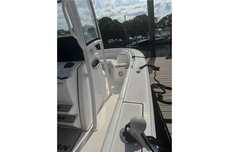 Slide: The Image of 2021 Sportsman Heritage 251 Center Console docked, showcasing sleek design and modern features. - 17