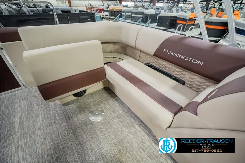 Slide: The Image of 2027 Bennington 22 SLJ boat interior with beige and brown seating. - 35