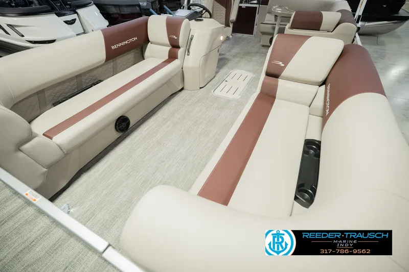 Slide: The Image of 2027 Bennington 22 SLJ pontoon boat interior with beige and brown seating. - 13