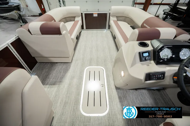Slide: The Image of Interior of a 2027 Bennington 22 SLJ pontoon boat with plush seating and modern dashboard. - 24