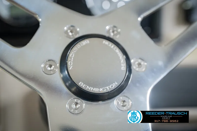 Slide: The Image of Close-up of Bennington 22 SLJ 2027 steering wheel with Reeder-Trausch Marine logo. - 41