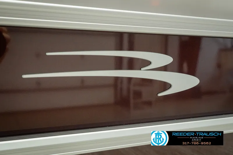 Slide: The Image of 2027 Bennington 22 SLJ boat logo with Reeder-Trausch Marine contact details. - 57