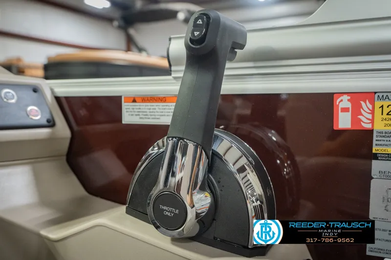 Slide: The Image of Throttle control of 2027 Bennington 22 SLJ boat, featuring sleek design and safety labels. - 48