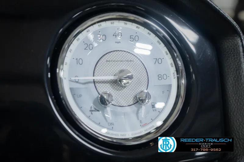 Slide: The Image of Close-up of 2027 Bennington 22 SLJ speedometer, displaying mph and km/h. - 45