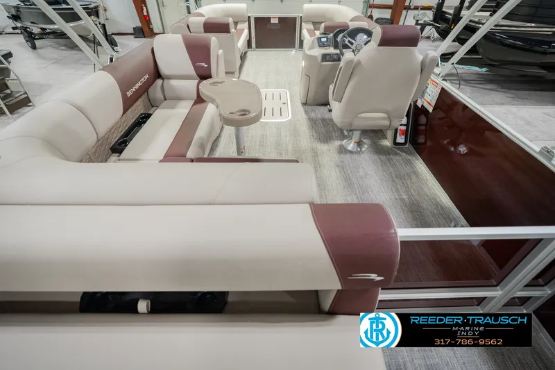 Slide: The Image of Interior of 2027 Bennington 22 SLJ pontoon boat with plush seating and modern helm. - 22