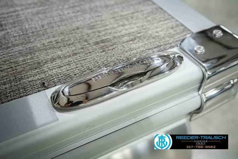 Slide: The Image of Close-up of 2027 Bennington 22 SLJ boat detail with chrome finish and textured surface. - 62