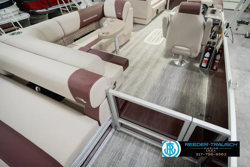 Slide: The Image of Interior view of a 2027 Bennington 22 SLJ pontoon boat with beige seating. - 16