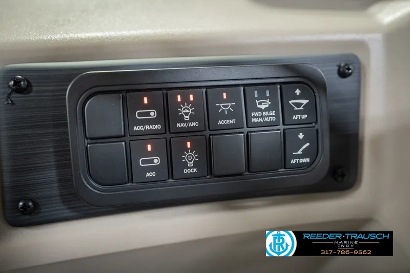 Slide: The Image of Control panel of a 2027 Bennington 22 SLJ boat with various switches and indicators. - 42