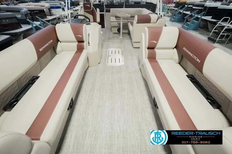 Slide: The Image of 2027 Bennington 22 SLJ pontoon boat interior with beige and brown seating. - 18