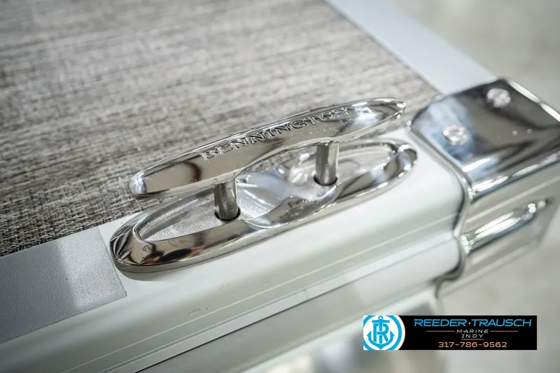 Slide: The Image of Close-up of a 2027 Bennington 22 SLJ boat cleat with Reeder-Trausch Marine logo. - 63