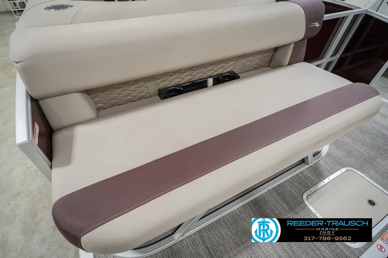 Slide: The Image of 2027 Bennington 22 SLJ boat seat with beige and brown upholstery, showcased by Reeder-Trausch Marine. - 53