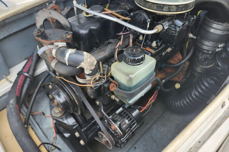Slide: The Image of Engine compartment of a 2008 Bayliner 185 boat, showing detailed mechanical components. - 19