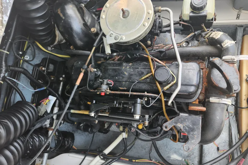 Slide: The Image of Engine of a 2008 Bayliner 185 boat, showing detailed components and wiring. - 17