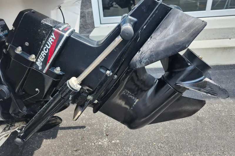 Slide: The Image of Mercury outboard motor on a 2008 Bayliner 185 boat, showing propeller and drive unit. - 4