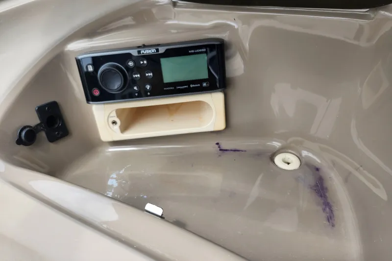 Slide: The Image of 2008 Bayliner 185 boat dashboard with Fusion MS-UD650 stereo system. - 25