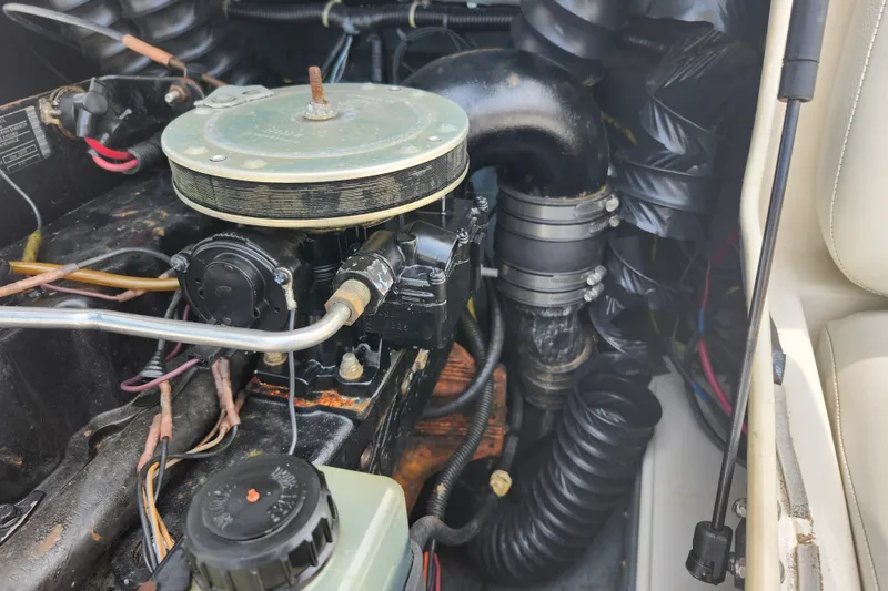 Slide: The Image of Engine compartment of a 2008 Bayliner 185 boat, showcasing mechanical components and wiring. - 20