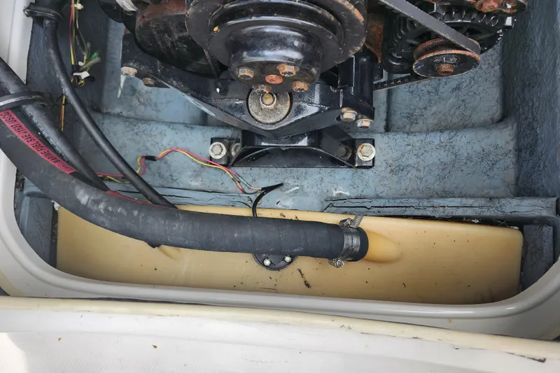 Slide: The Image of Engine compartment of a 2008 Bayliner 185 boat, showing hoses and mechanical components. - 21