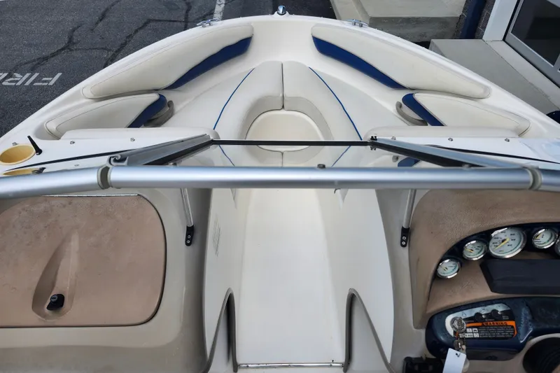 Slide: The Image of 2008 Bayliner 185 boat interior with seating and dashboard view. - 31