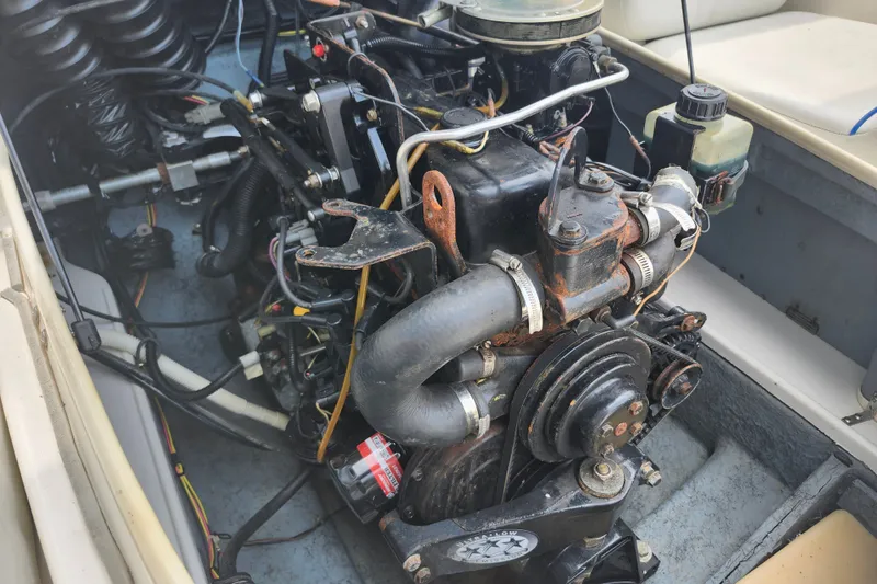 Slide: The Image of Engine compartment of a 2008 Bayliner 185 boat, showing detailed mechanical components. - 16