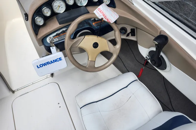 Slide: The Image of 2008 Bayliner 185 boat cockpit with steering wheel, gauges, and Lowrance device. - 27