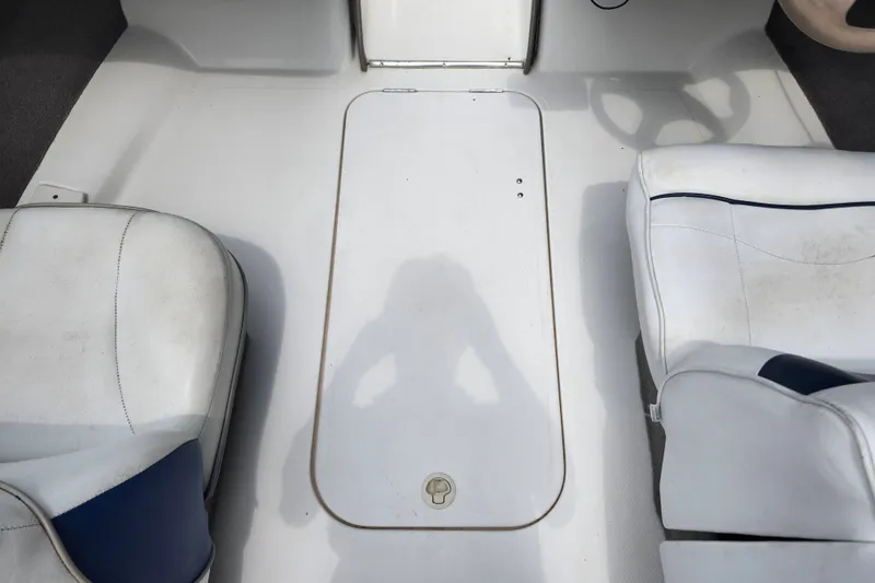 Slide: The Image of Interior of a 2008 Bayliner 185 boat showing seating and deck details. - 22