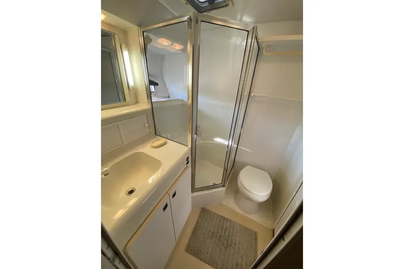 Slide: The Image of Bathroom interior of 1995 Silverton 41 Convertible yacht with shower and sink. - 21