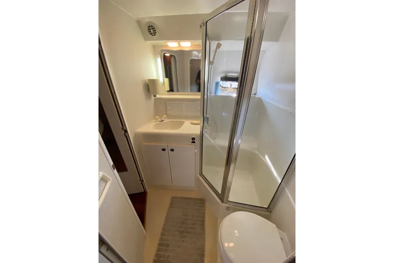 Slide: The Image of Bathroom interior of 1995 Silverton 41 Convertible yacht with shower and vanity. - 20